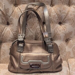 A Designer Tignanello Purse.  The Outside Is Gold With Silver Highlights